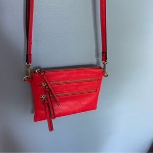 Pink leather purse with cross body strap